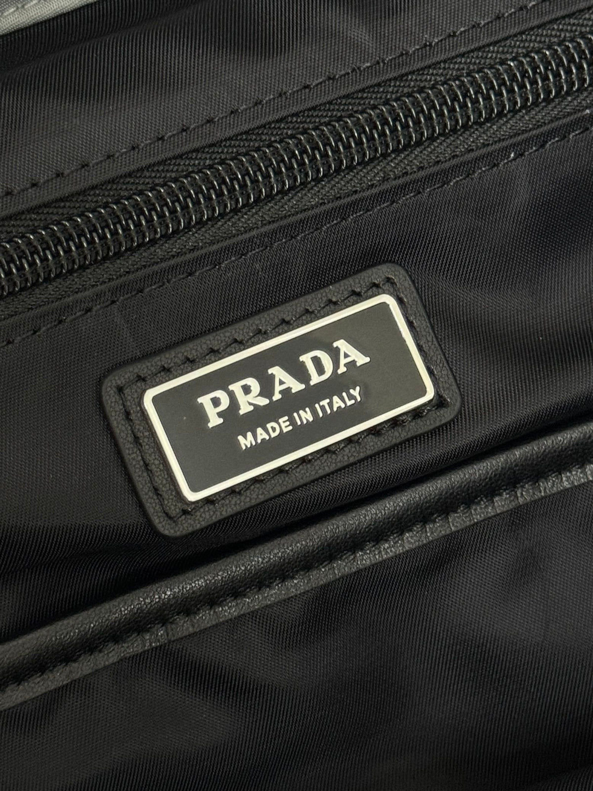 PRADA TRIANGLE LOGO BACKPACK 42 IN RHINO GRAY RE-NYLON